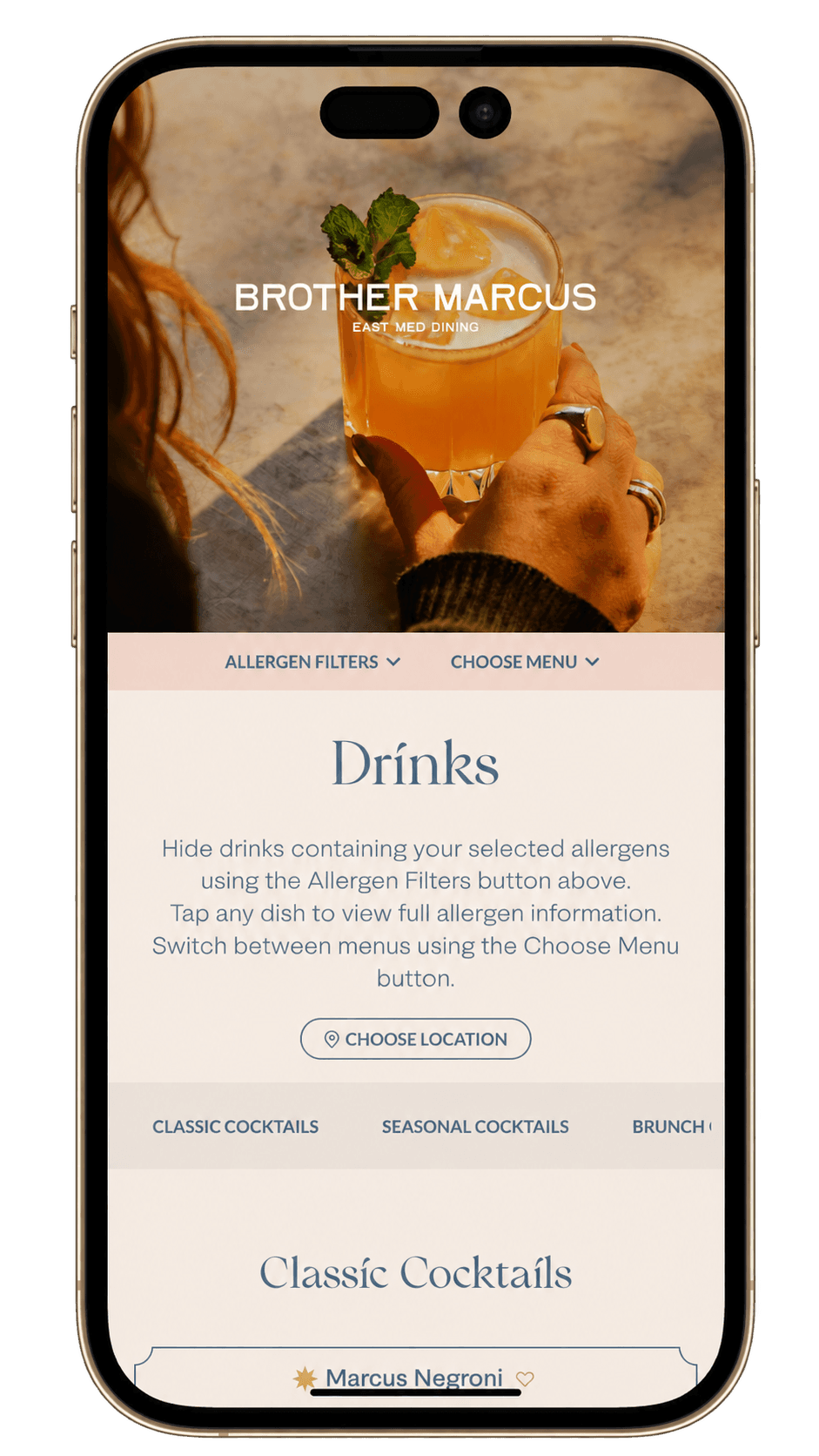 Brother Marcus drinks menu on a phone